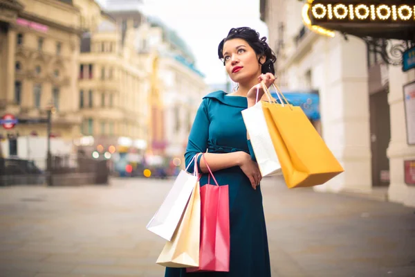 Beautiful woman doing shopping in a city
