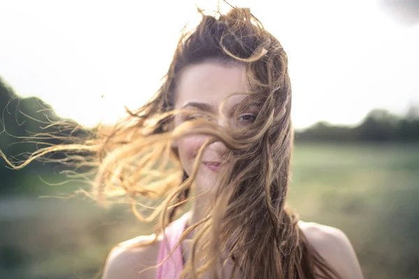 Beautiful woman walking in a wild park