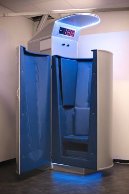 Modern cryotherapy machine in the room clipart