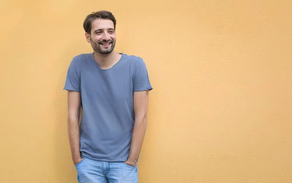 Handsome young man  over wall background