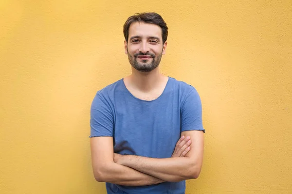 Handsome young man over wall background