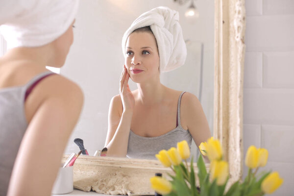 Beautiful young woman doing morning routine