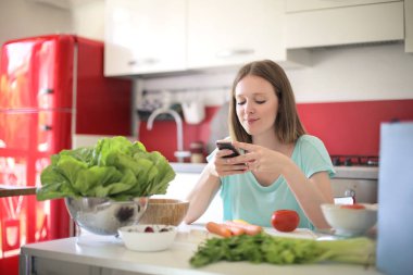 young beautiful woman taking picture of food 