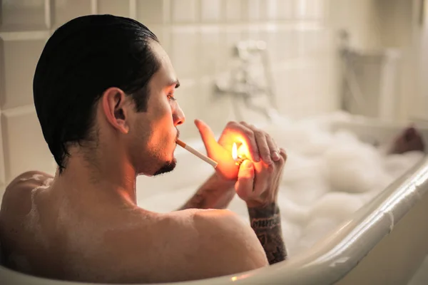 Handsome Young Man Smoking Bath Tube — Stock Photo, Image