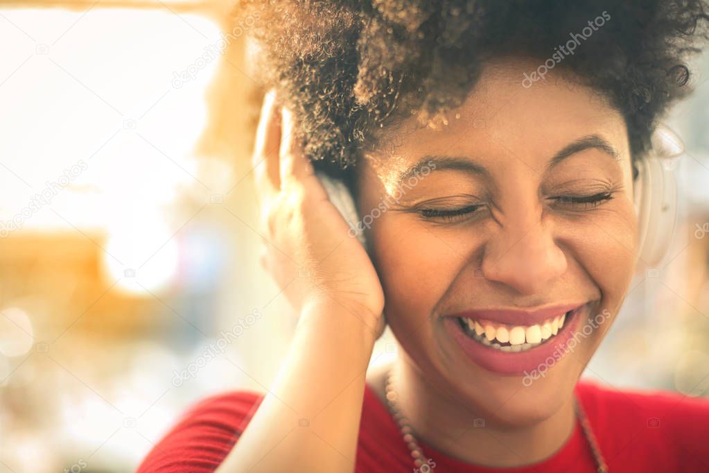 Girl laughing while listening music