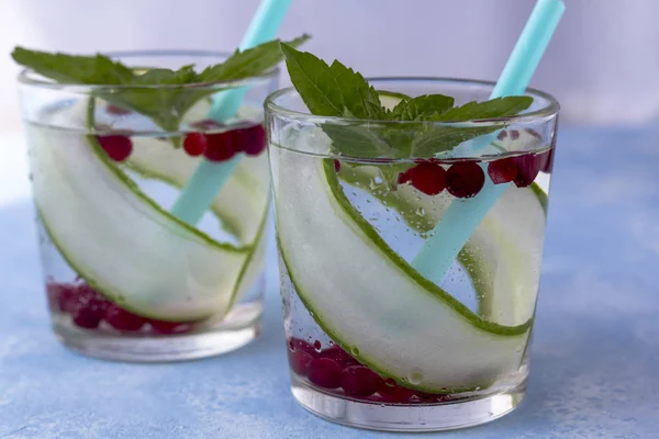 Fresh cool detox drink with cucumber and berries, lemonade in a — Stock Photo, Image