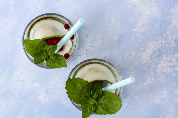 Fresh cool detox drink with cucumber and berries, lemonade in a — Stock Photo, Image