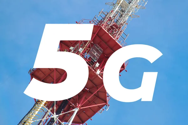 Inscription 5G and telecommunication, cellular tower and antenna. Radio tower with 4G, 5G network against blue sky