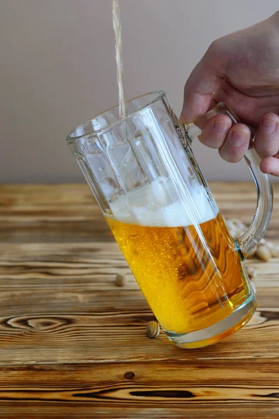 filling a glass with beer