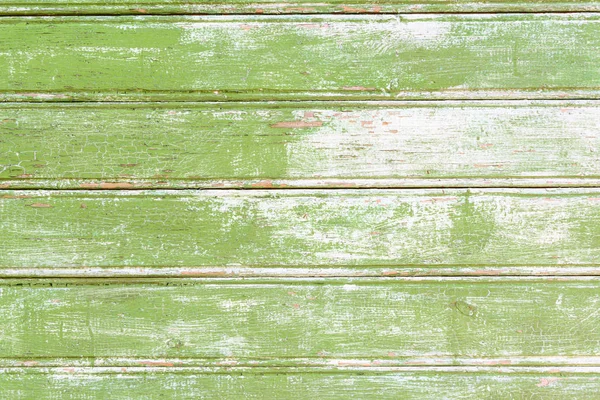 Background from a vintage wood painted in green paint with scuffs.