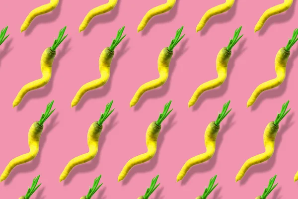 Yellow Ugly Carrot Pattern Pink Background Ugly Vegetables Concept — Stock Photo, Image