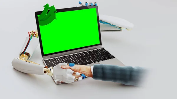 Robot hands coming out of the laptop for a handshake.
