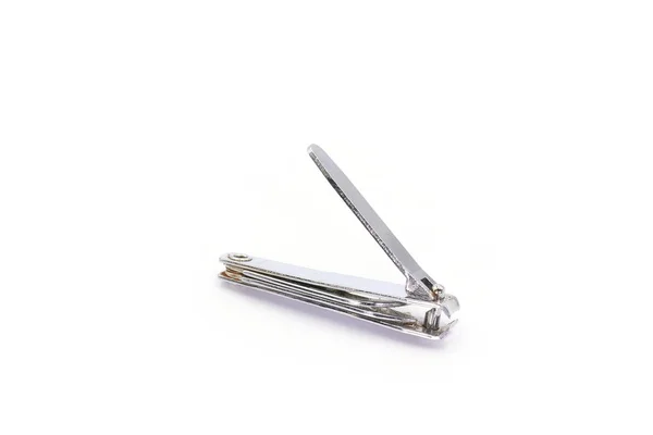 Cut nails for manicure, steel nail clippers isolated on white ba