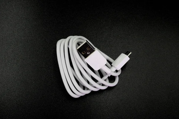 Cable connector micro-USB to USB on black background. — Stock Photo, Image
