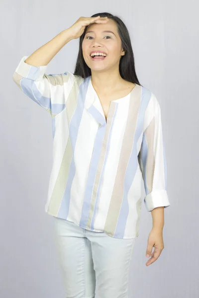 Businesswoman wearing shirt posing smile thinking isolated on gr — Stock Photo, Image