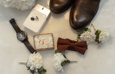 Stylish men's accessories on a white background. Wedding accessories.
