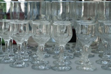Wine glasses on a table at a wedding reception. Selective focus.