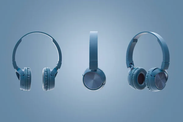 Bluetooth Blauer Kopfhörer Auf Blauem Hintergrund Studio Pack Shot Equipment Stockbild