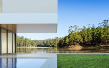 Orman gölü arka planında gündüz yüzme havuzlu lüks modern ev manzarası, minimal mimari tasarım fikri. 3d oluşturma