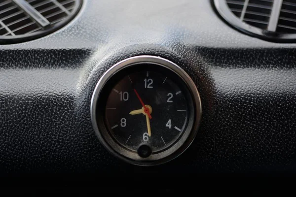 Black control panel with heater grilles and a clock with hands in an old Russian car — Stock Image Black Control Panel Heater Grilles Clock Hands Old Russian Car Stock Photo