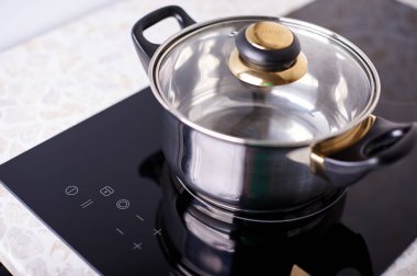 İndüksiyon Ocağı, potu metal üzerine