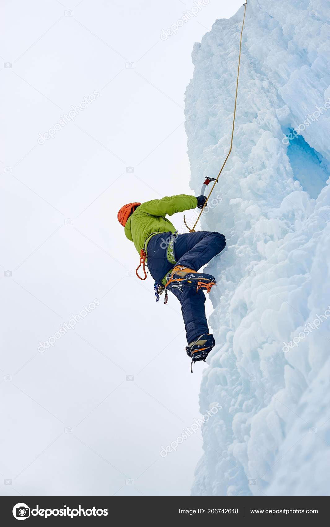 Alpinist Man Ice Tools Axe Orange Helmet Climbing Large Wall Stock