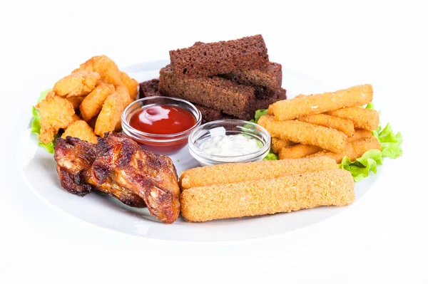 Assorted Hot Snacks Chicken Nuggets Roasted Cheese Croutons Onion Rings — Stock Photo, Image