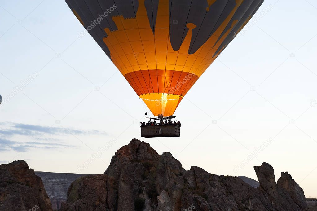 Hot Air Balloon Flight Cappadocia Tour Goreme Open Air Museum, Flying hot air balloons rise in sunrise Cappadocia. Goreme National Park Turkey.
