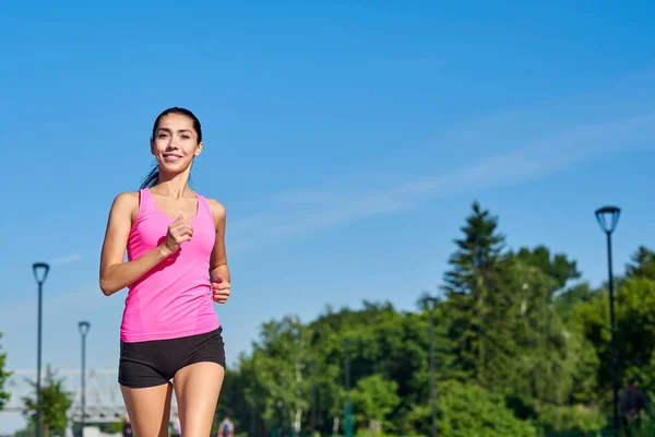 Young fitness woman running at forest trail. — Stock Photo, Image