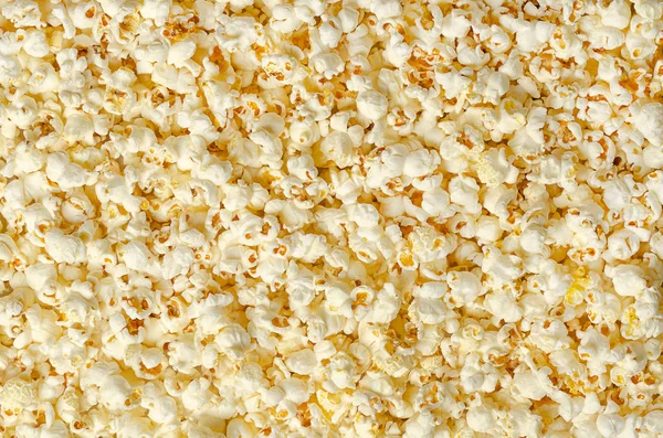 Patlamış mısır, patlamış mısır, yüzey ve arka plan. Bu ısıtmalı sonra kelebek şeklinde patlamış mısır çekirdekleri kabarık. Yenilebilir, ham, organik ve vegan. Makro gıda fotoğraf, portre, yukarıdaki üzerinden.