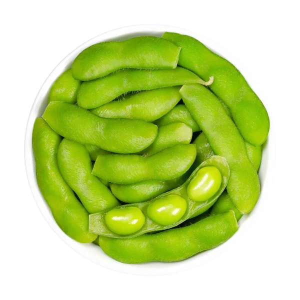 Green soybeans in the pod, edamame, in white bowl — Stockfoto