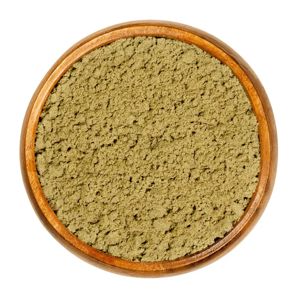 Hemp protein powder in wooden bowl. Ground seeds of Cannabis sativa. Gluten free dietary supplement food for athletes. An alternative or a substitute to whey protein. Closeup, from above, food photo.