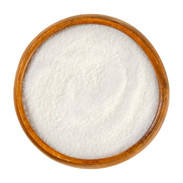 Kristal sitrik asit, ahşap bir kasede monohidrat. Beyaz kristalleri olan zayıf bir organik asit. Turunçgil meyvesi. Asitleştirici, aroma ve şelasyon aracı olarak kullanılır. Yukarıdan yakın çekim, fotoğraf..