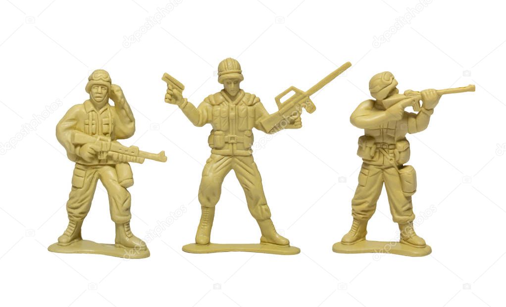 plastic toy soldiers with guns on white background