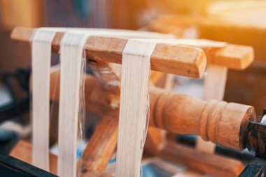 Traditional spinning wheel machine for making natural silk from 