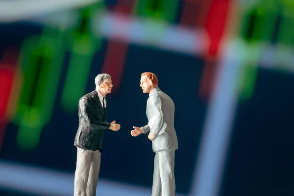 Business Agreement Concept Two Businessman Figurine Shaking Hands Front Blurry — Stock Photo, Image