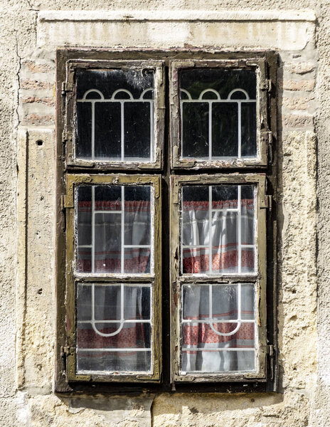 It is an old wooden window