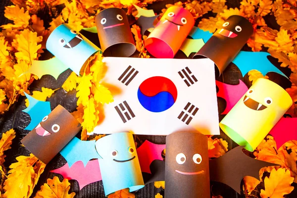Holiday Halloween. Korea. Autumn holiday. Vampires against the background of yellow leaves. Decoration for the holiday of Halloween in Korea. the flag of the Republic of Korea.