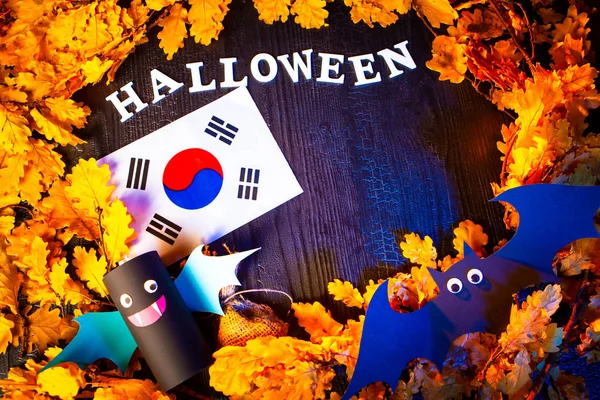 Holiday Halloween. Korea. Autumn holiday. Vampires against the background of yellow leaves. Decoration for the holiday of Halloween in Korea. the flag of the Republic of Korea.