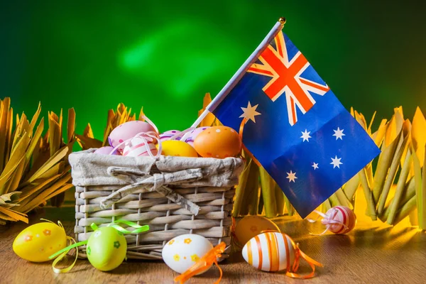 Holiday of Easter in Australia. Holidays in Australia. Colored eggs. Flag in the basket. Eggs for the holiday.