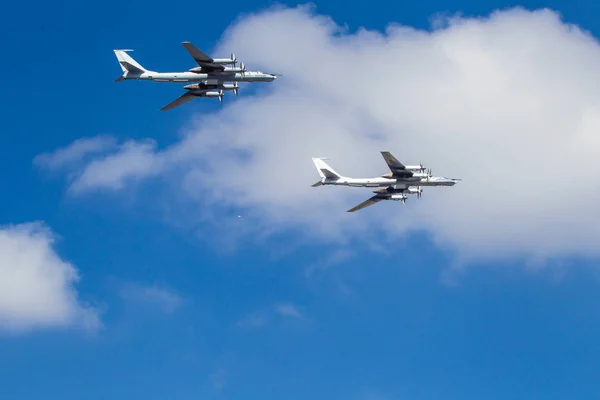 Military aircraft. Aircraft on a background of white clouds. Military bombers.