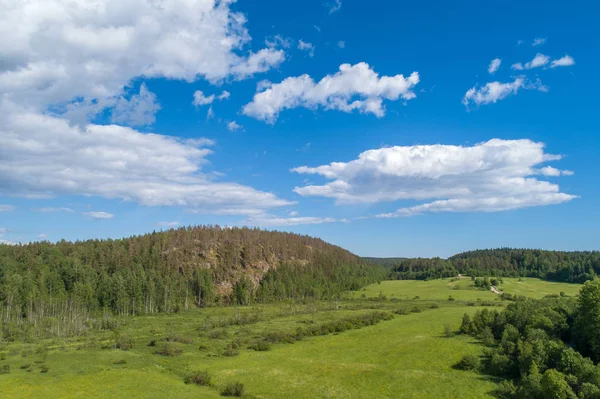Karelia. Russia. Field. Mountain with trees. The Republic of Karelia. A panorama of the nature of Russia. — Stock Image Karelia Russia Field Mountain Trees Republic Karelia Panorama Nature Russia Royalty Free Stock Photos