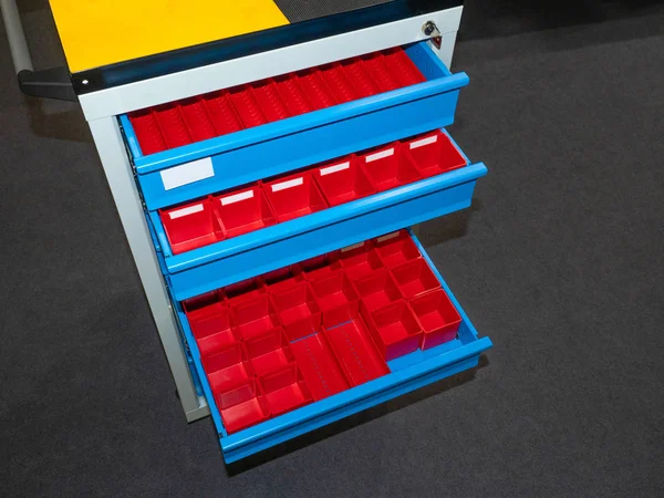 Toolbox. Retractable shelves with containers. storage of spare parts. Organizer for hardware. Storage of hardware.