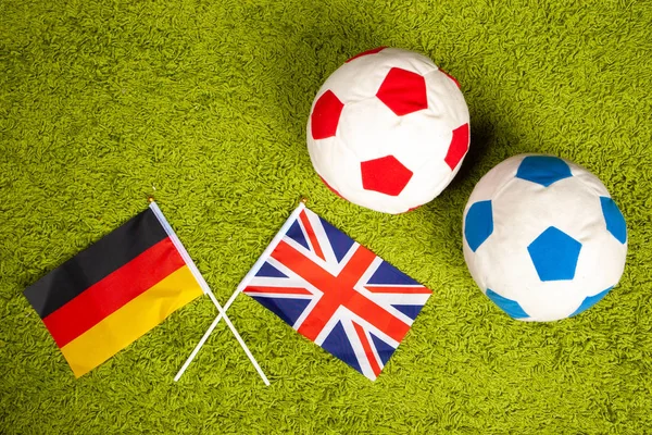 Meeting of the National football teams of Germany and England. Flag of England on the football field. Flag of Germany on the football field. Football concept. Football game.