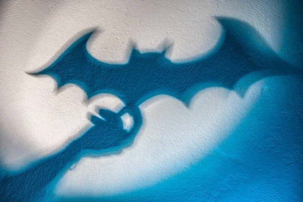 Shadow of a bat on the wall. Halloween. Batman. Concept.