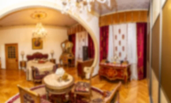 Blurred background of the room with a bed. Bedroom. Antique furniture. Room with an arch. Retro interior.