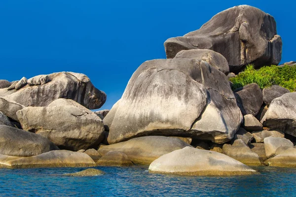 Thailand. Sea cruise on the Similan Islands. Large stones on the beach. Travel around the island of Phuket. The nature of Thailand.