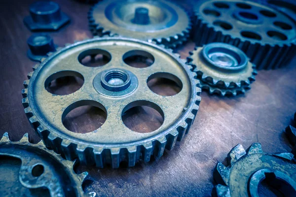 Metal old gears. Blue gears. Many gears of different sizes are o