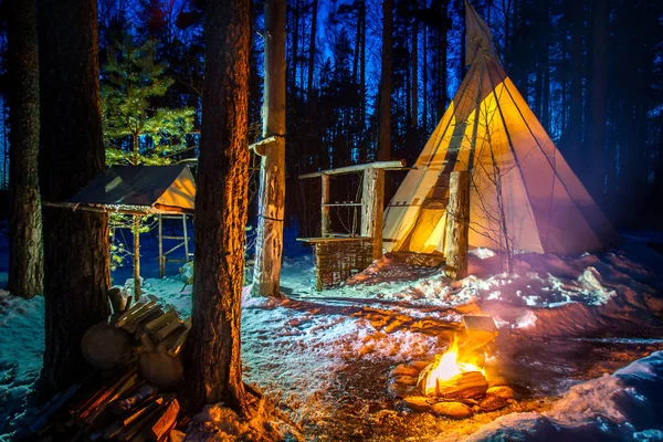 Tipi. Indian Home. Wigwam. Forest in winter. Ecotourism. Ethnography. Themed travel.