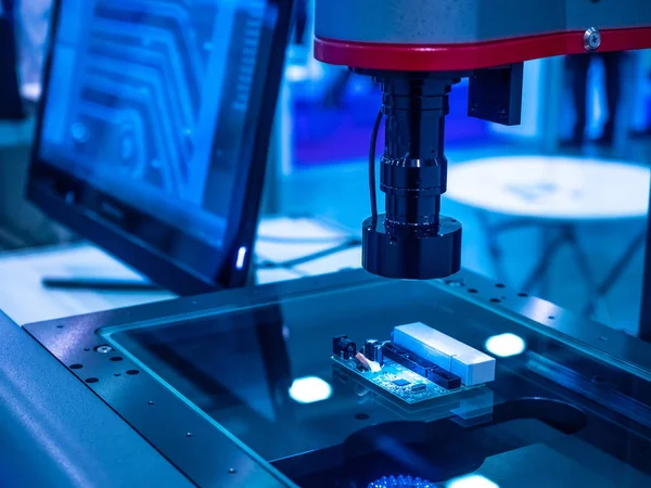 Chip manufacturing. Computer microscope examines the chip. The board lies under the microscope. Manufacturing chips.